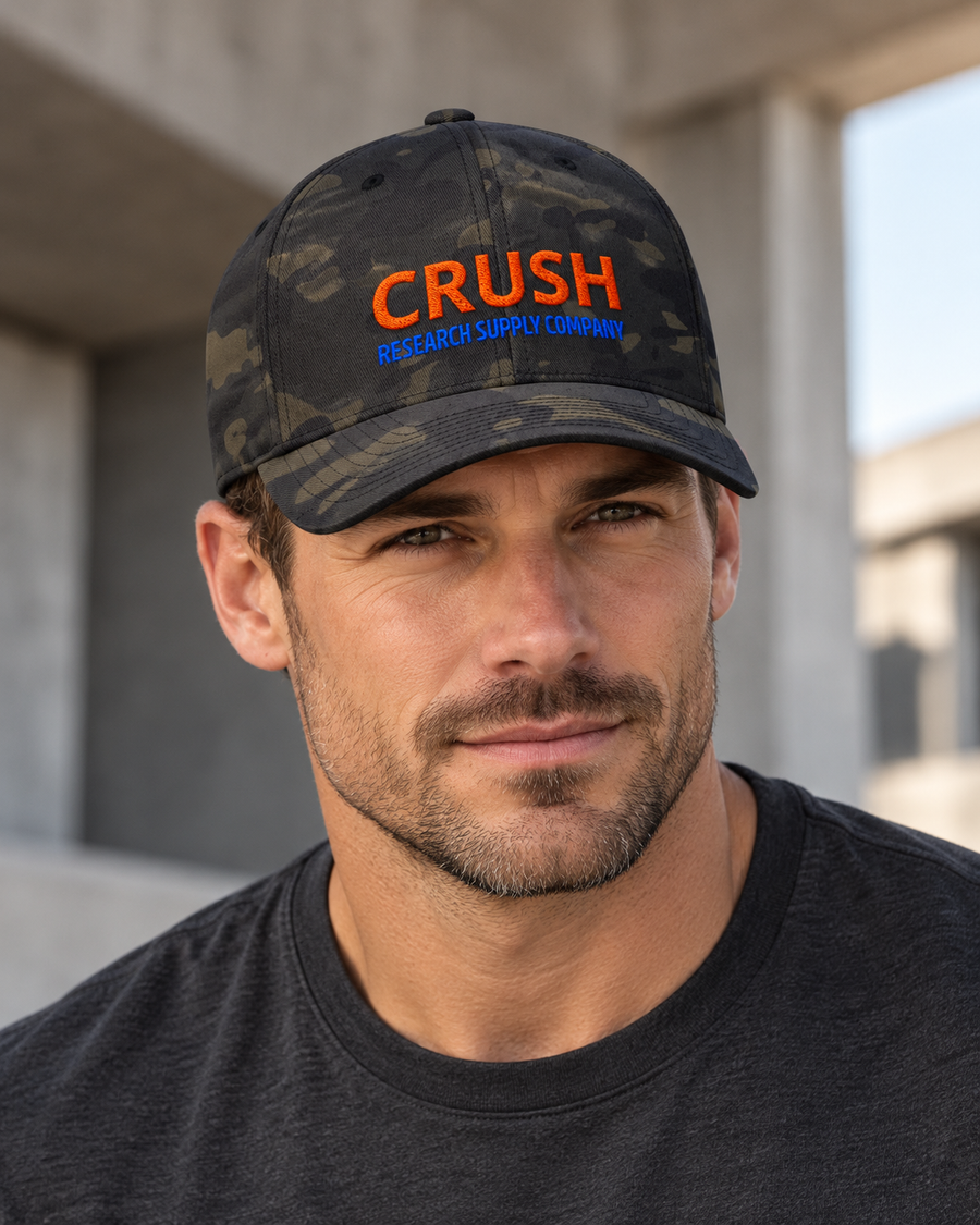 Model wearing CRUSH Research Supply Company Flexfit cap in Multicam Black