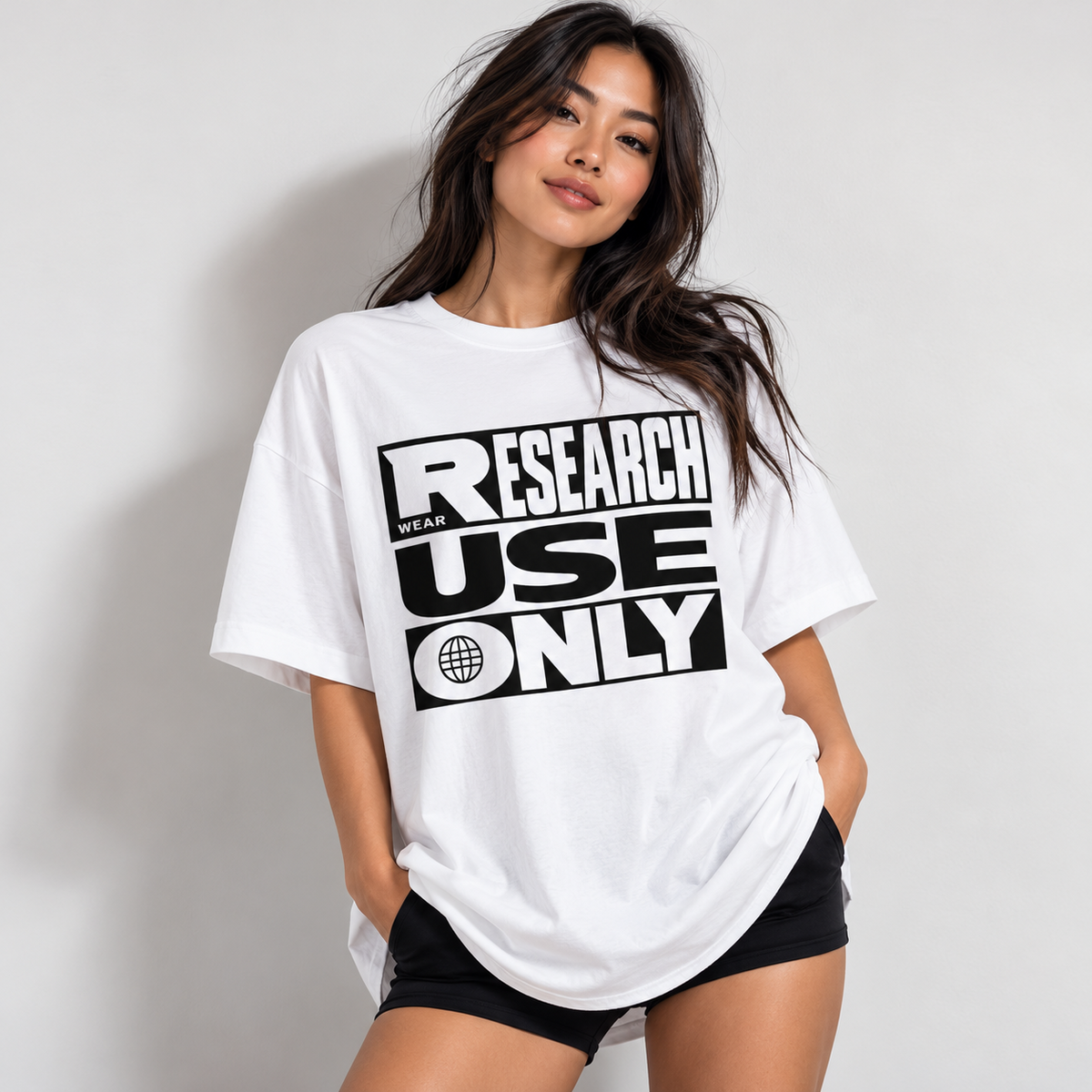 Woman wearing the white Research Use Only oversized tee